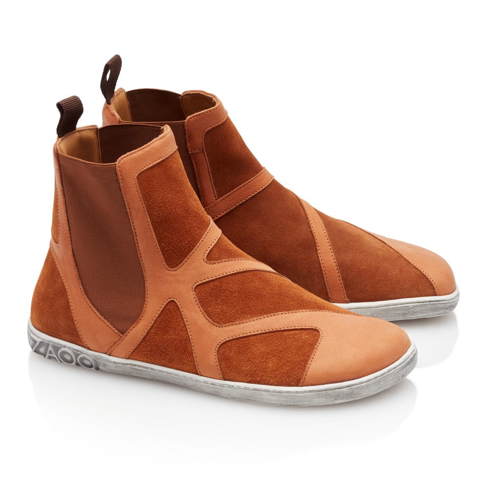 Diese stylischen QEY WEST Cognac High-Top-Sneaker von ZAQQ bieten eine Mischung aus Wildleder- und Ledertexturen. Sie verfügen über elastische Seitenteile und eine Aufreißlasche an der Ferse und ruhen auf einer weißen Gummisohle mit Markengravur, wodurch Stil und Komfort nahtlos miteinander kombiniert werden.